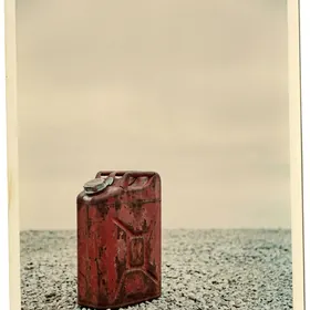 Rusted jerrycan in gravel
